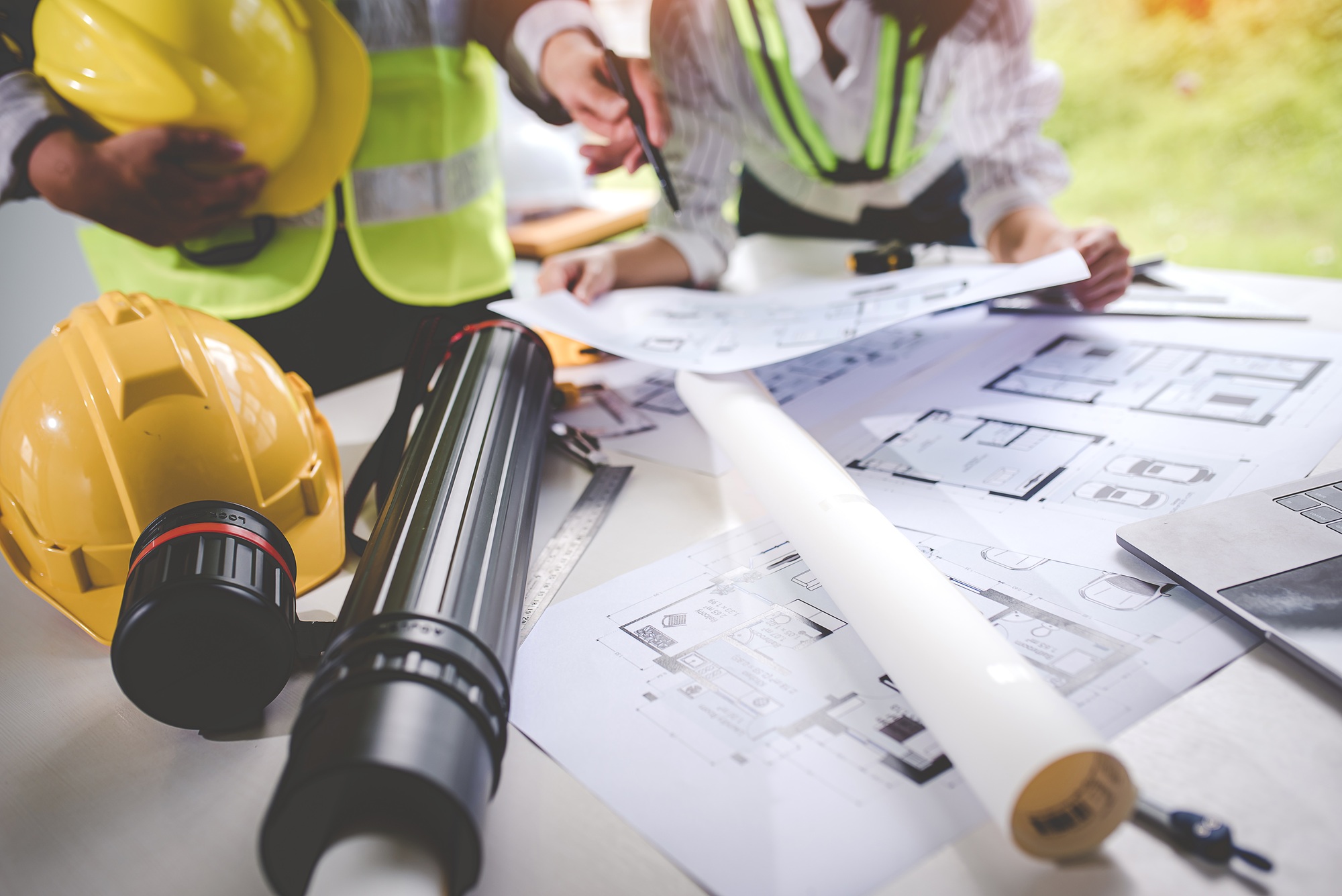 architect concept, working architect with blueprints in office to present to customers